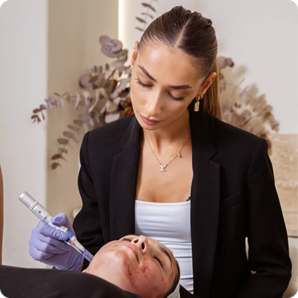 A student performing a skin treatment